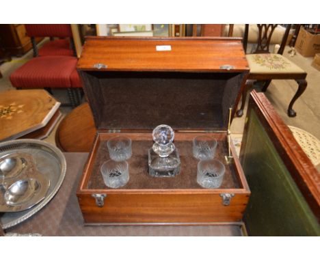 An Edwardian mahogany and inlaid decanter box containing a decanter and four tumblers 