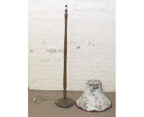 A turned mahogany standard lamp and shade.