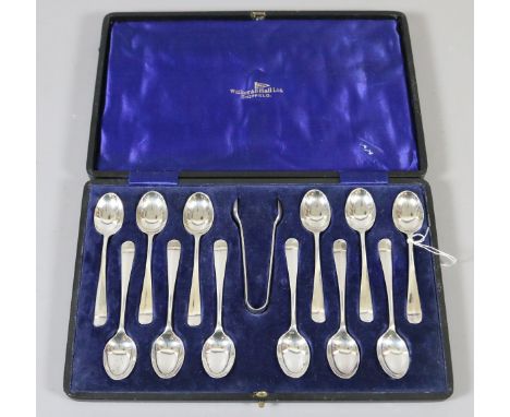 A cased set of twelve silver teaspoons and sugar nips by Walker 7 Hall. Assayed Sheffield 1925, 160 grams.