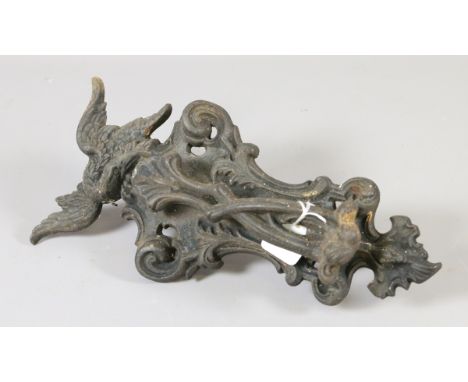 A Victorian Coalbrookdale cast iron door knocker surmounted by an eagle.