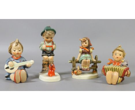 Four W Goebel made in West Germany Hummel figures of children.