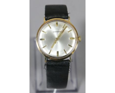 A gentleman's 9ct gold Garrard manual wristwatch with satin dial, centre seconds and baton markers, presentation inscription 