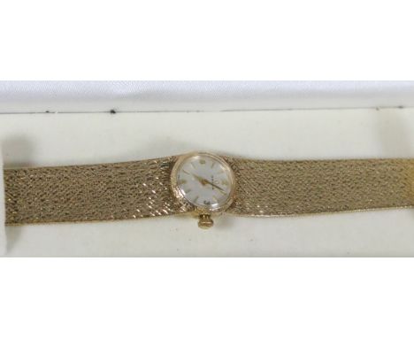 A ladies 1970s 9 carat gold Omega manual bracelet watch with satin dial, baton and Arabic markers. Ref 484. Weight without mo