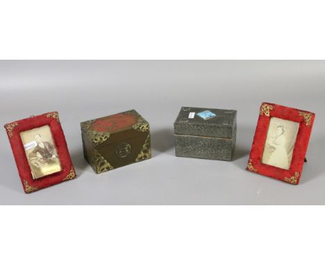 Two playing cards boxes and two photograph frames.