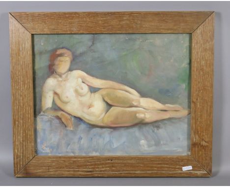 An oak framed oil on canvas naive portrait of a reclining nude.