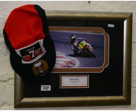 A framed Barry Sheene motorcycle racing print, along with a baseball cap and badge.
