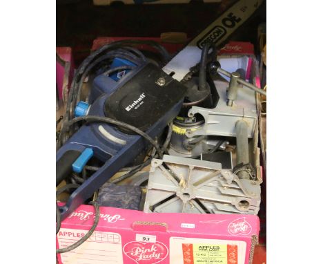 A box of various tools to include an Oregon 240 volt electric chain saw.