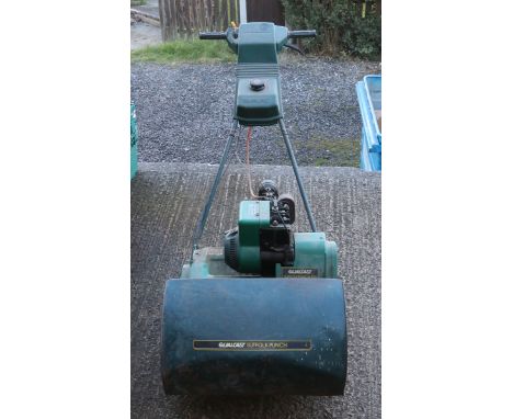 A petrol engine Qualcast Suffolk Punch 43S lawnmower with grass box (AF).