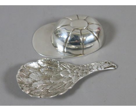 Two novelty silver tea caddy spoons by C J Vander one formed as a bird in flight and the other modelled as a jockeys cap, 42 