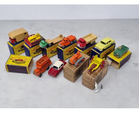 Seven boxed Lesney Matchbox Models including No.12 Land Rover (box flap missing), No.40 Lorry, No.18 Bulldozer, No.15 Lorry, 