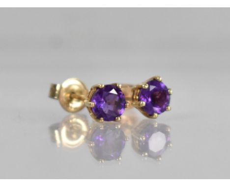 A Pair of 9ct Gold and Amethyst Earrings, Stone Measuring 5mm Diameter and Supported in Six Yellow Metal Claws, 1.1gms 