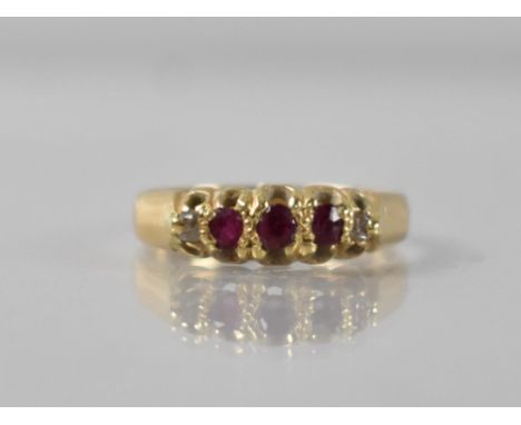 A Victorian 18ct Gold, Ruby and Diamond Ring, Three Old Mixed Round Cut Rubies in Raised Claw and Tension Mount with Two Simi