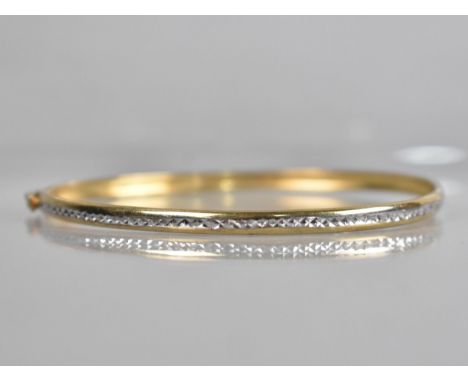 A 9ct Gold Two Tone Bangle having Central Channel with Etched White Metal Decoration, Stamped to the Interior but Illegible a
