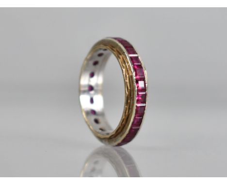 An Early 20th Century Ruby Eternity Ring, Channel Set, Mixed Step Cut Stones Each Measuring Approx 2.1mm by 1.7mm in Raised W