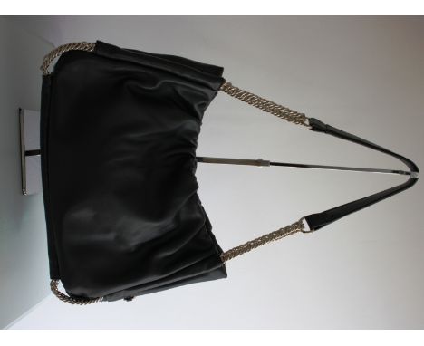 L K BENNET soft black leather handbag. Features gold tone chain hardware, a strong magnetic fastening and inner pockets lined