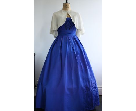 Vintage 1930s capelet and 1950s electric blue, beaded evening gown.A vintage 1930s ivory silk, velvet capelet with diamante d