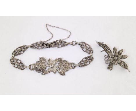 A marcasite floral bracelet marked STERLING and a marcasite brooch marked SILVER (2)