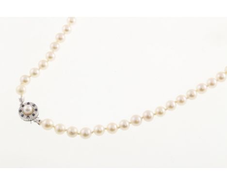 A single row of pearls with a pearl & sapphire set clasp stamped 585, approx 28 inches, each pearl approx 7mm