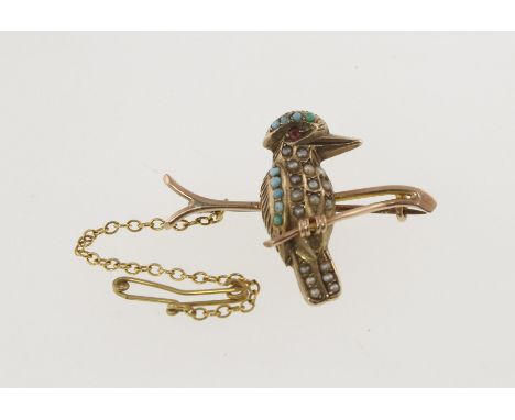 An Edwardian Kookaburra bar brooch, seed pearl turquoise set, marked 9ct with safety chain