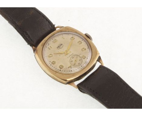 A 1950's 9ct cushion-shaped ENICAR manual-wind wristwatch with fitted leather strap, working 