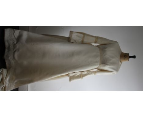 1960s ivory satin wedding dress. Featuring statement trumpet sleeves, Tatting lace trim, full skirt and small train. Very goo