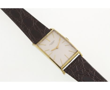 A 1960's UNIVERSAL Geneve rectangular gents wristwatch with working manual wind movement, gold plated case & fitted leather s