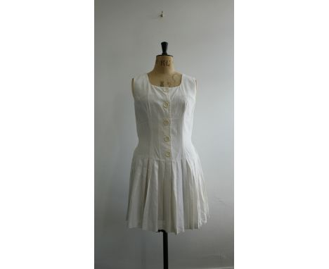 Vintage 1950s ladies tennis dress. Sleeveless, button front with short pleated skirt and button back belt (button missing) in