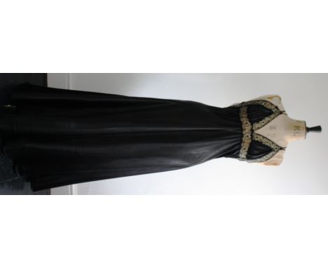 1980s black satin and lace item of lingerie/nightwear. Full length, features lace and net back ruffle and crossover straps. S