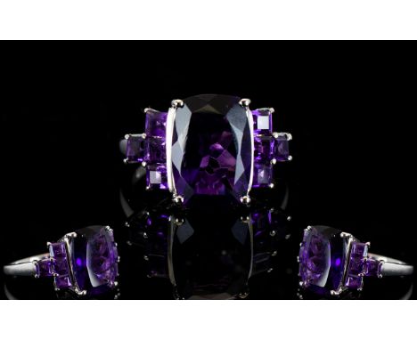 Amethyst Cushion and Square Cut Ring, an elongated cushion cut solitaire amethyst of 6cts, with a royal purple hue, flanked b