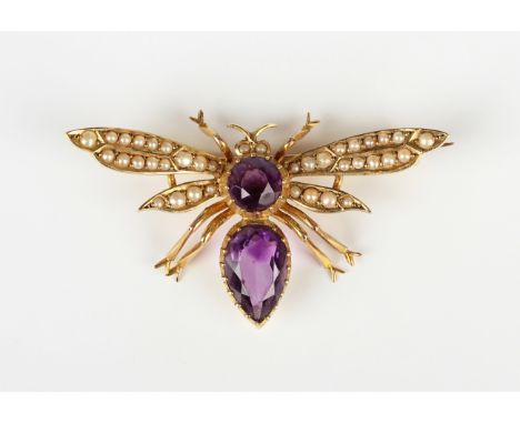 An Edwardian gold, amethyst and half-pearl brooch, designed as a winged insect, the body mounted with a circular cut amethyst