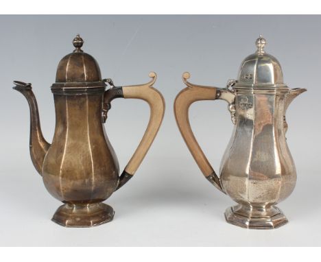 A pair of George V silver café-au-lait pots, each of octagonal baluster form on an octagonal domed foot, London 1913 by S.W. 