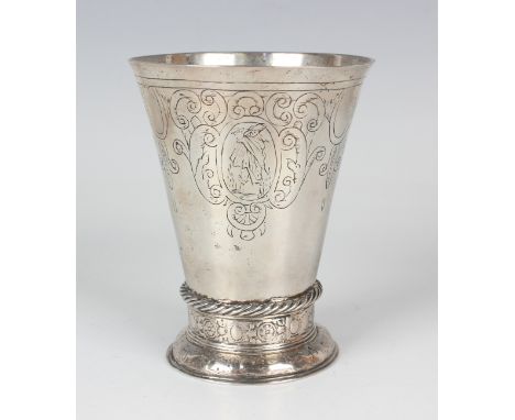 A late 17th century Continental silver beaker, probably Dutch or German, of tapering cylindrical form with slightly flared ri