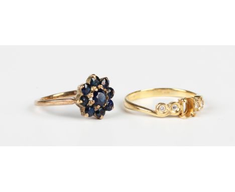 An 18ct gold and diamond ring, collet set with four circular cut diamonds, import mark London 1998, weight 2.3g, ring size ap
