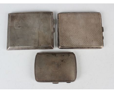 Three George V silver engine turned rectangular cigarette cases, Chester 1922 and 1929 and Birmingham 1926, total weight 370.