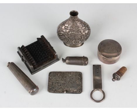 A small group of silver items, comprising a late Victorian pen nib wipe of rectangular form, fitted with bristles flanked by 