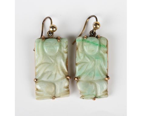 A pair of Chinese gold mounted rectangular jade pendant earrings, each carved as a figure, with wire fittings, unmarked, leng