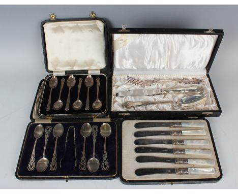 A set of six George V silver teaspoons, each with pierced scroll handle, and a pair of matching sugar tongs, Birmingham 1915 