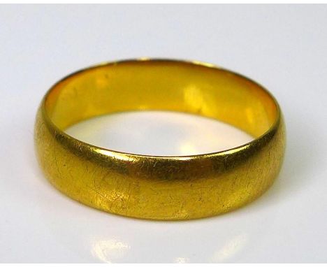 A 22ct gold band, size K/L, 3.5g. 