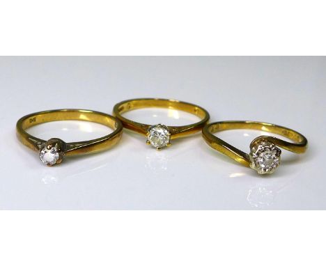 A group of three 9ct gold and diamond solitaire rings, diamonds sized between 0.1 and 0.2ct, size K/L, 4.7g total weight. (3)