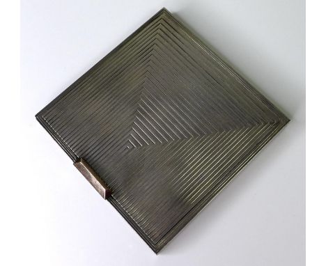 An Art Deco silver compact mirror, of square form with engraved geometric decoration and engine turned internal lift lid prot