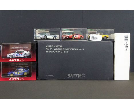 Seven Boxed / cased diecast model racing cars to include an Autoart Signature Nissan GT-R FIA GT1 World Championship 2010 1:1