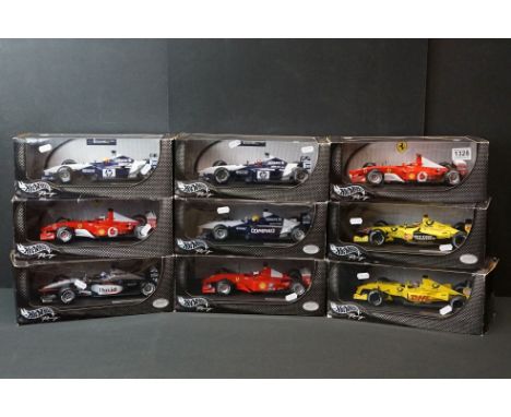 Nine boxed 1/18 Mattel Hot Wheels Racing diecast models to include 54626 Michael Schumacher, 54624 Ralf Schumacher, 54625 Jua