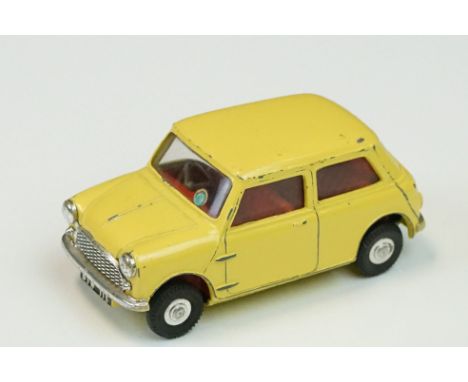 Six mid 20th C play worn Triang Spot On diecast models to include Volkswagen in red, Auston Seven in yellow, Austin 1800 in p