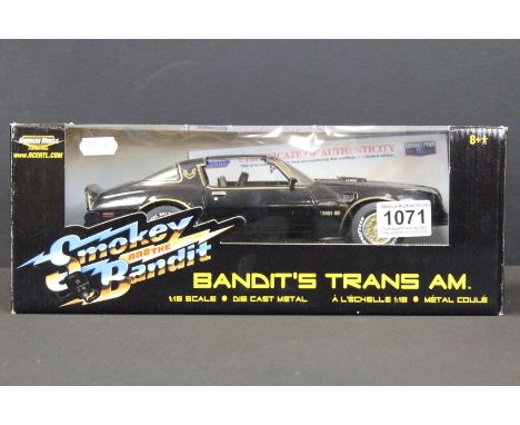 Autograph - Boxed 1/18 American Muscle ERTL Collectibles Smokey and the Bandit Bandit's Trans AM diecast model signed by Burt