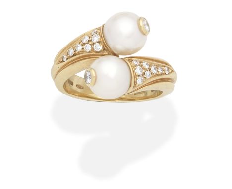 BULGARI: CULTURED PEARL AND DIAMOND RINGEach 7.4mm cultured pearl accented by a brilliant-cut diamond, between similarly-cut 