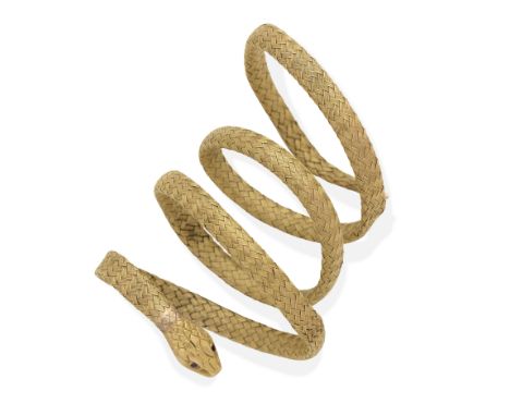 SNAKE BANGLE, LATE 19TH CENTURYOf woven design, set with circular-cut red gemstone eye, deficient one gemstone eye, French as