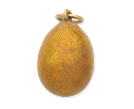 FABERGÉ: ENAMEL EGG PENDANTDecorated in golden yellow guilloché enamel, maker's mark HW for Henrick Wigstrom, Russian assay m