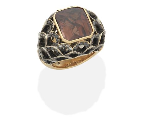 TOURMALINE, BLACK DIAMOND AND DIAMOND RINGCheckerboard-cut brownish pink tourmaline, brilliant-cut diamonds and circular-cut 