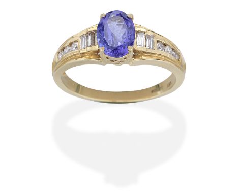TANZANITE AND DIAMOND RINGSet with an oval-cut tanzanite, baguette and brilliant-cut diamonds, mounted in 18 carat gold, tanz
