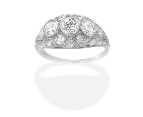 DIAMOND RINGOf bombé design, set with old brilliant and cushion-shaped diamonds, diamonds approx. 1.70cts total, ring size ap